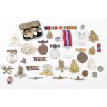 Tin of assorted Cap Badges & Medals WWII and later