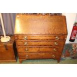 George III Oak fall front bureau with oval brass handles supported on bracket feet