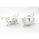 A pair of silver sauce boats, each on three legs - marks rubbed - Chester 1900 - 321g total weight