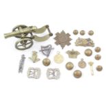 Collection of assorted Cap badges and a Brass canon
