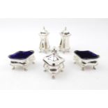 Five Piece George V Silver Cruet set Diamond shaped supported on pad feet by Walker & Hall,