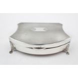 A Silver shaped bow-front jewellery box on pad feet - 4.5" wide - with Silver Jubilee mark 1935
