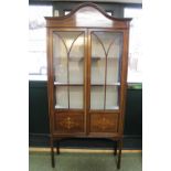 Edwardian Inlaid Glazed China cabinet with arched top over glazed doors and straight legs