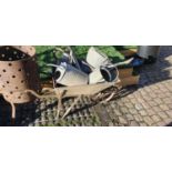 Vintage Galvanised and wrought metal wheelbarrow and a collection of galvanised Watering cans