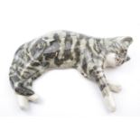 Large Winstanley Cat in laying pose, signed to underneath