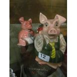 Two NatWest pig money boxes