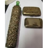 Two small silver cigarette cases and a green bottle in silver cover