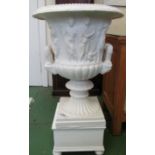 A large white painted classical design urn on stand