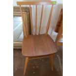 Two Ercol light wood kitchen chairs