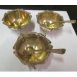 A set of three silver salts with embossed edges, and three salt spoons, and a silver bowl C1900