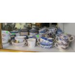 Various blue and white willow pattern cups and other china