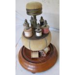 A Victorian three section sewing stand with pin cushion