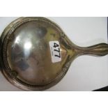 A silver backed hand mirror