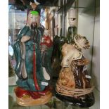 An Oriental figure and a Mexican lamp