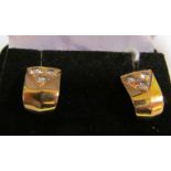 A pair gold and diamond earrings