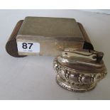 An Art Deco silver colour cigarette box and lighter
