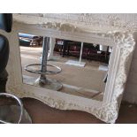 A white painted scroll framed mirror