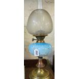 A brass oil lamp with blue glass reservoir (repaired)