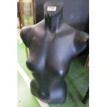 A black half-mannequin