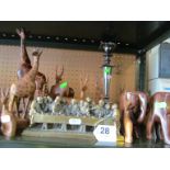 A plated candlestick, (a/f), brass Last Supper, and treen animals.
