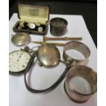 Three silver napkin rings, two compacts, pocket watch et cetera