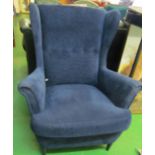 An Ikea chair upholstered in blue