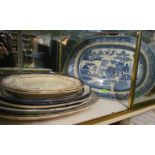 A large willow pattern meat plate and other meat plates (s/a/f)