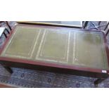 A military style leather inset top coffee table of three drawers