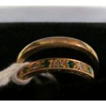 An 18ct gold emerald and diamond ring and a 9ct gold ring