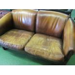 A brown leather settee