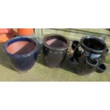 Three black garden pots