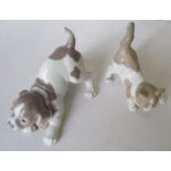 A Lladro crouching dog and a Lladro crouching cat