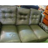A green leather settee
