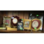 A freestanding mirror, various miniatures of ladies and small pictures