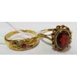 A ruby diamond and garnet ring