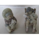A Lladro Eskimo child with bear and a Lladro child asleep in rocking chair
