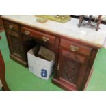 An Edwardian twin pedestal desk with marble top