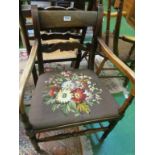 An oak ladder back rush seat chair and an elbow chair with tapestry seat