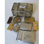 Various lighters, cigarette cases et cetera in metal box