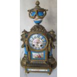 A 19th Century gilt mantel clock with urn finial Sevres style plaques and columns, bow and wreath