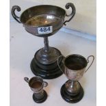 A silver two handled challenge cup and two smaller ones