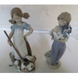 A Lladro girl with broom and kittens and a Lladro boy with dog