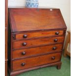 A 19th Century mahogany bureau the fall front revealing fitted interior above four graduated