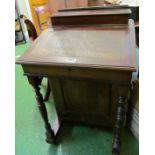 A Victorian Davenport with four drawers and dummy en verso