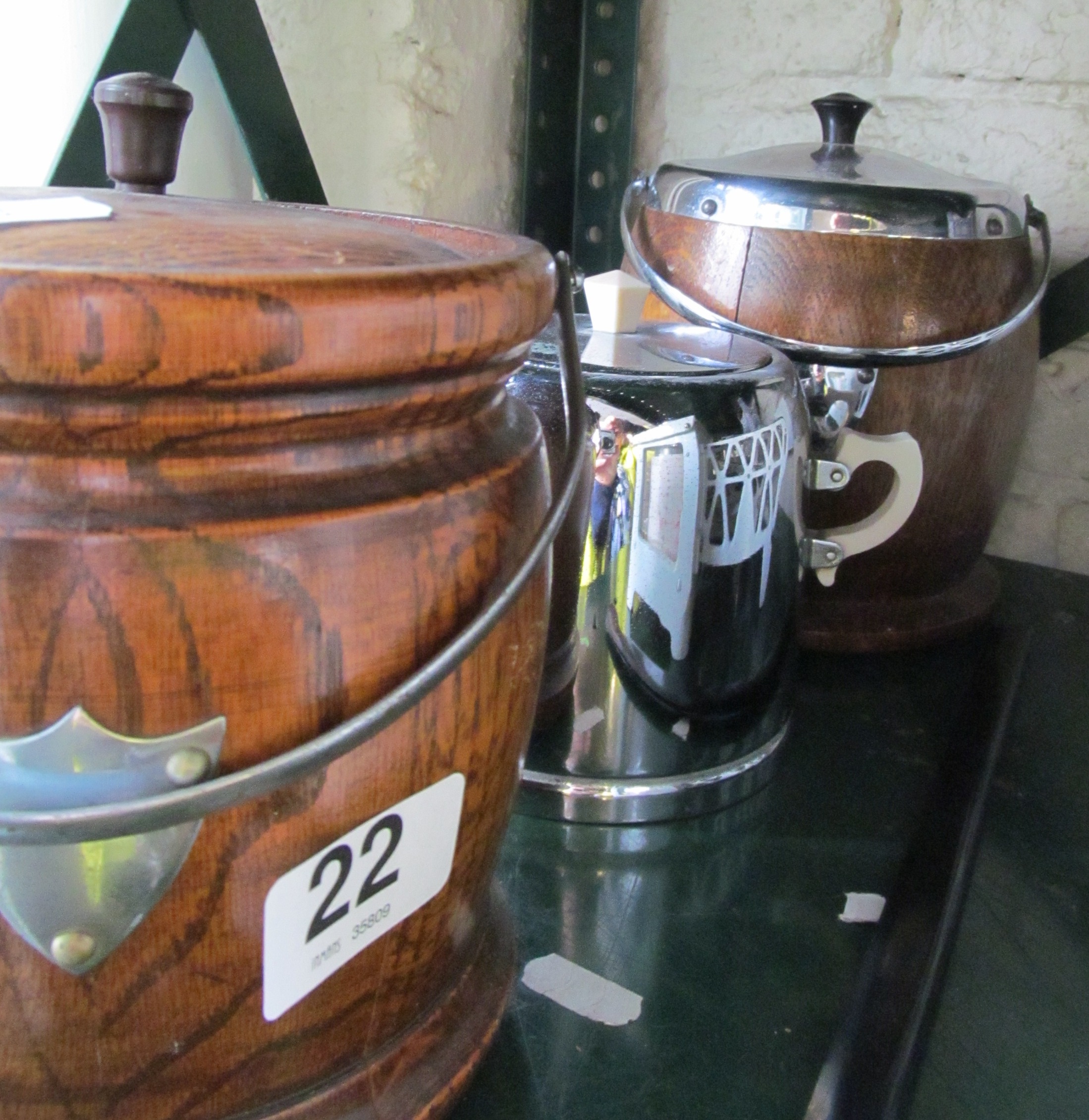 A retro tea caddy and two other wooden tea caddies.