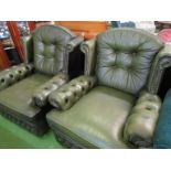 Two green leather chairs