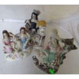 A Staffordshire flatback figure girl with sheep, another two girls on shell design base and