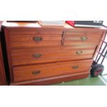 An Edwardian chest of two short and two long drawers