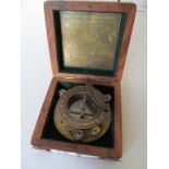 A brass boxed sextant.