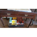 An Edwardian side table of two drawers